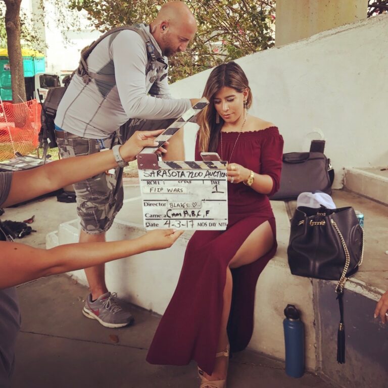 A clapperboard marking a Flip Wars scene with Ivana Shoultz on set